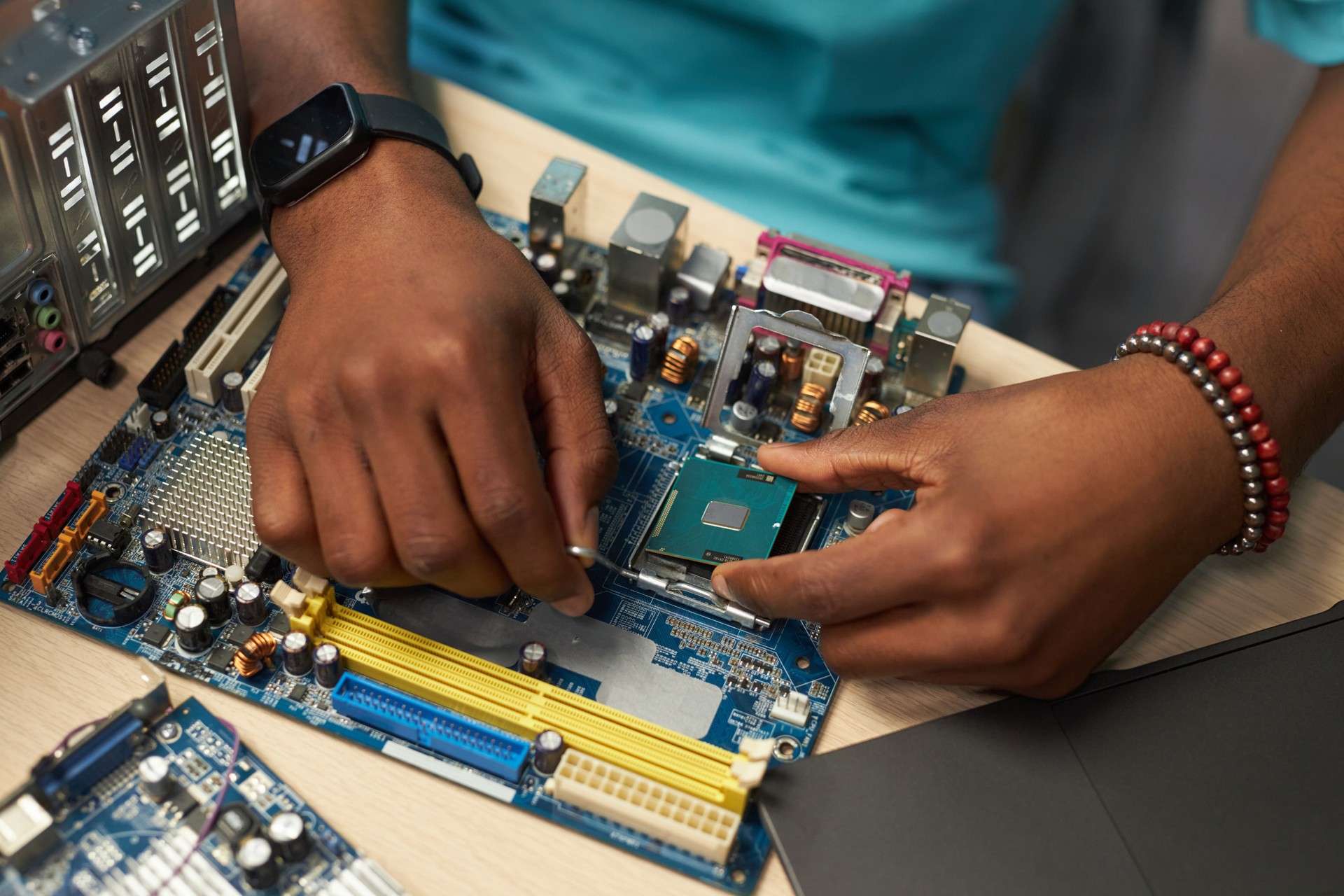Repairman Working With Computer Details